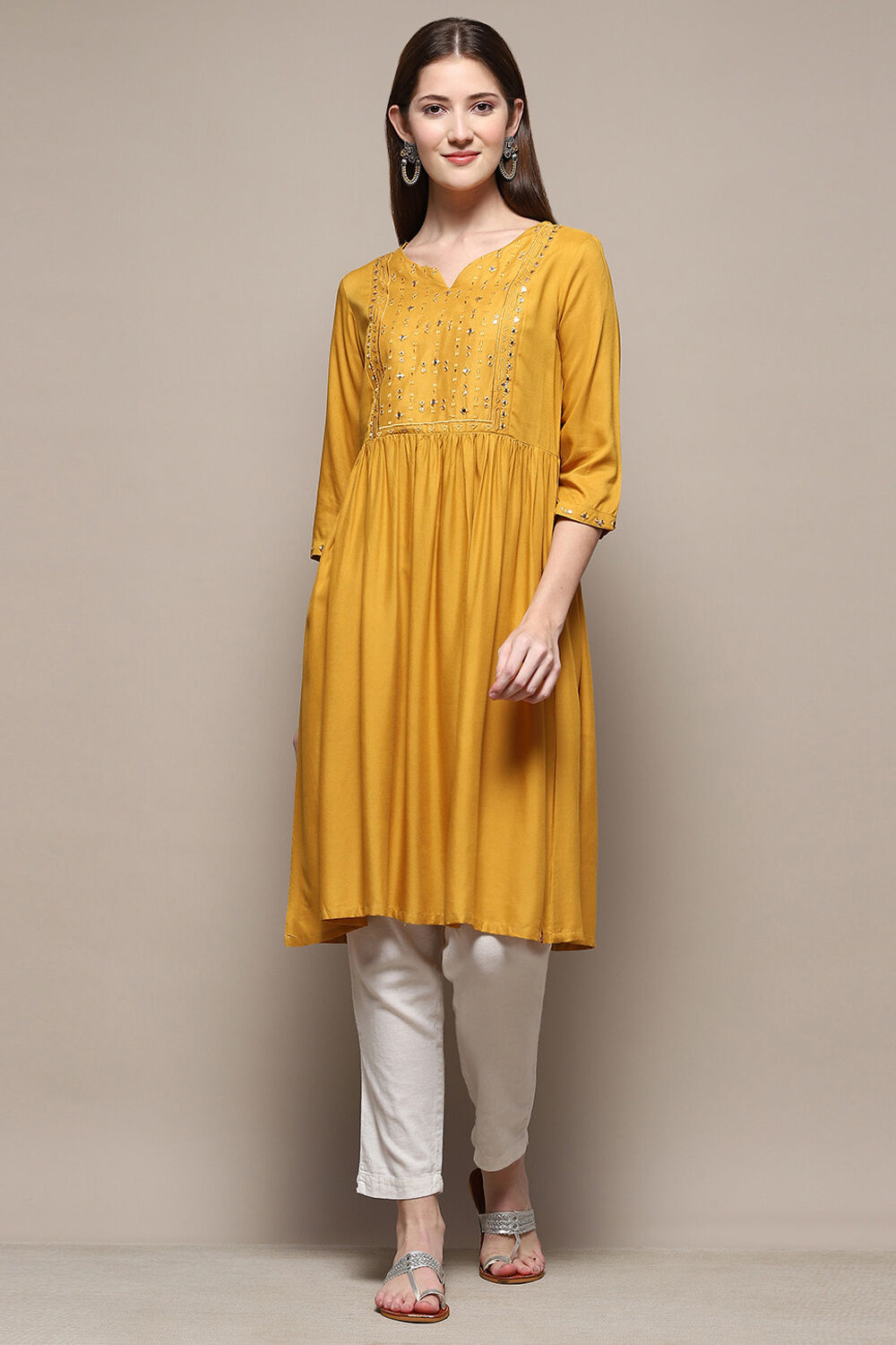 Mustard Rayon Short Solid Kurti image number 0
