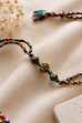 Multlicolor Antique Gold Rakhi With Green Beads image number 0