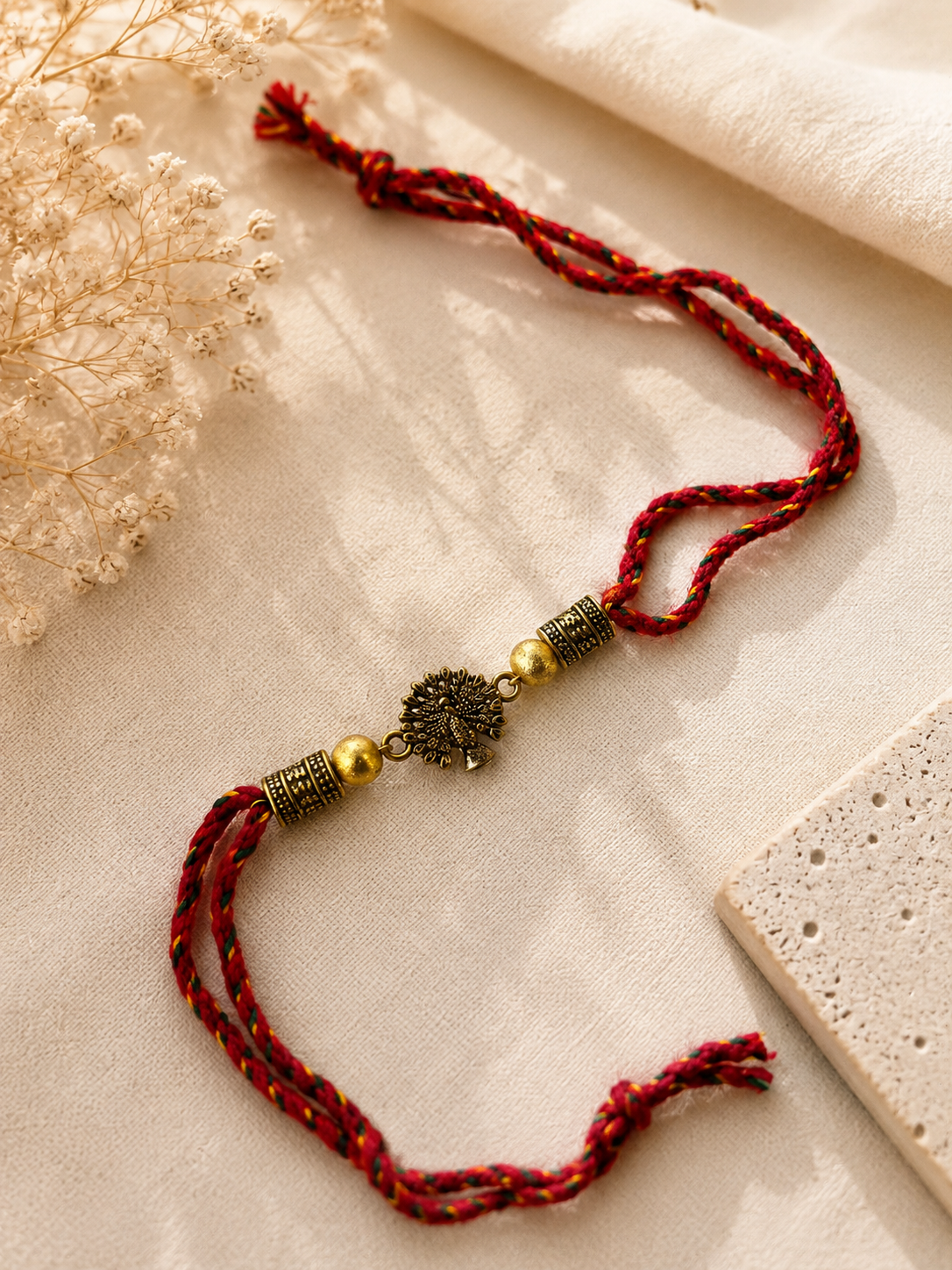 Red Mayur Raj Antique Gold Rakhi image number 1